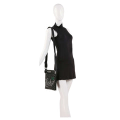 A mannequin in a sleeveless black mini dress showcases the HE Lucky Bling Crossbody Sling, featuring an adjustable strap, studded design, and Lucky in cursive on the front.