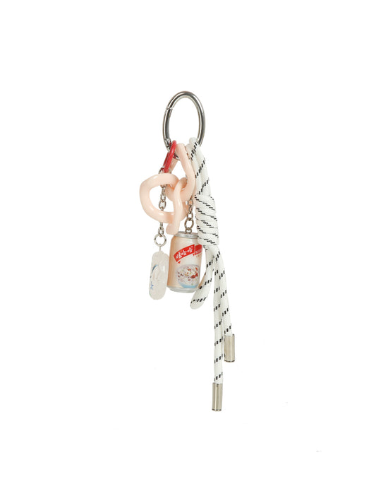 The HR Can Charm Keychain is a fun accessory featuring multiple charms—a pink plastic link, mini hand sanitizer with red label, silver tag, and striped white shoelace—all attached to a metal ring for a unique look.