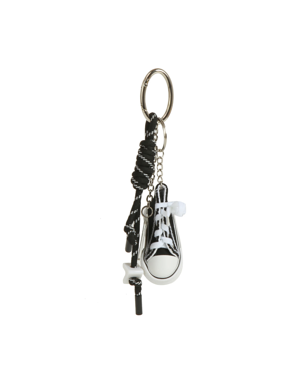 The HR Mini Sneaker Keychain features a black-and-white sneaker, coiled black cord, and sneaker charms on a silver keyring—an ideal streetwear-inspired accessory for your essentials.