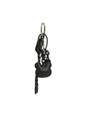 The HR Black Bear Charm Keychain features a modern black design with a bear charm, braided cord, and metal keyring, all in a sleek matching color scheme with decorative details.