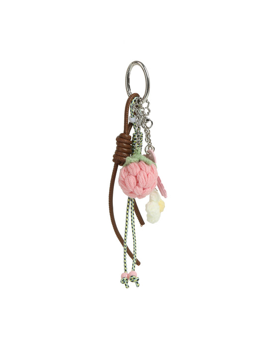 The HR Sweet Berry Blossom Crochet Keychain is a playful bag accessory featuring pink and cream crocheted flowers, a brown leather cord, green and white beaded string, and metal chain accents.