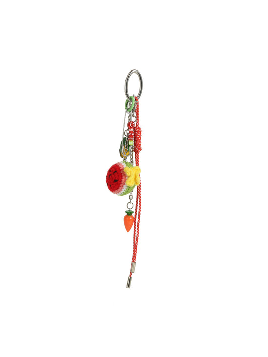 The HR Crochet Watermelon Keychain features a crochet watermelon ball, a small carrot charm, bright red string, and sturdy metal clasps, all displayed against a white background.