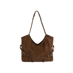 Brown leather handbag with a shoulder strap on a white background