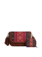 The HR Aztec Crossbody Set includes a brown faux leather crossbody bag and matching coin purse, both featuring colorful geometric tribal embroidery in red, pink, orange, blue, and black, finished with a playful tassel detail.