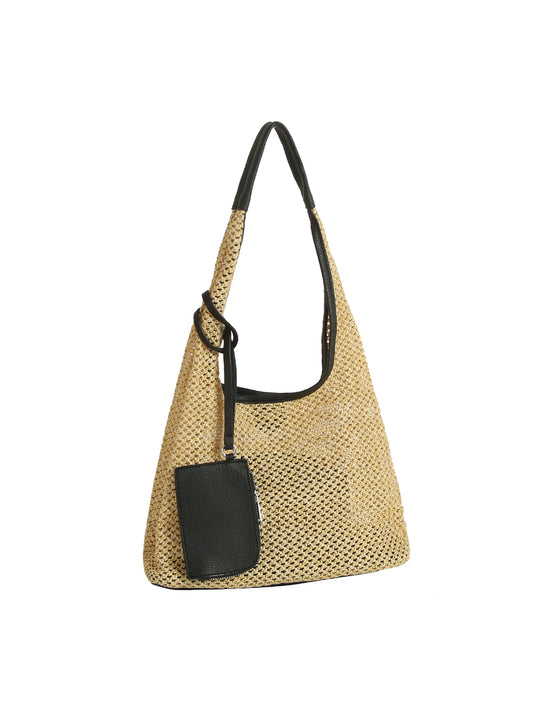 Woven handbag with a black strap and pocket on a white background