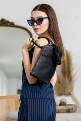 Braided ring handle wristlet clutch