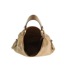 The LM 3 Piece Hobo Crossbody Wristlet in tan features gold hardware, a spacious interior with a zippered pocket, faux leather material, two sturdy handles, and a slightly slouchy shape.
