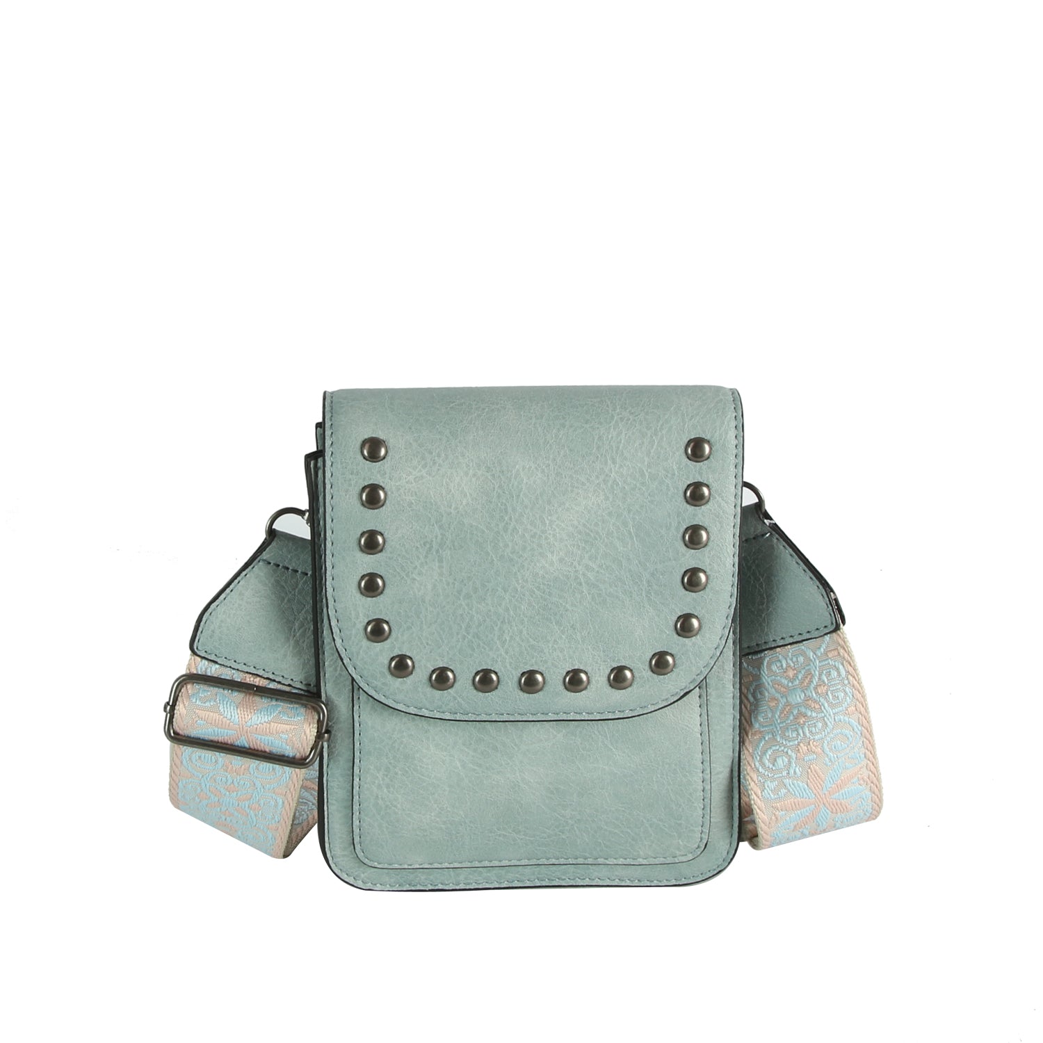 The LM Guitar Strap Flap Crossbody is a small, light blue leather bag with a studded flap and a wide beige and blue embroidered guitar strap for added style.