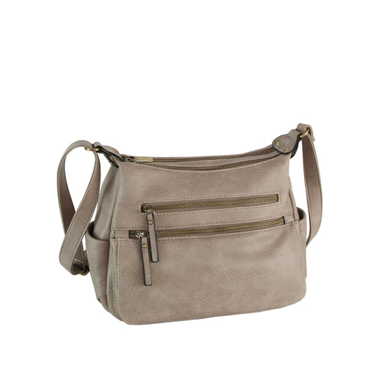 The LM Triple-Zip Organizer Crossbody is a taupe faux leather bag featuring an adjustable shoulder strap, three front zippered pockets, and a smooth, slightly textured finish.