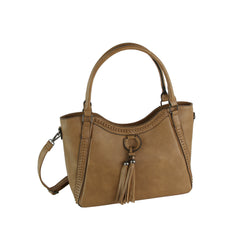 The LM Whipstitch Tassel Bead Accented Shoulder Tote is a tan faux leather boho handbag with double handles, a detachable crossbody strap, whipstitch details, and two tassels with bead accents on the front ring.