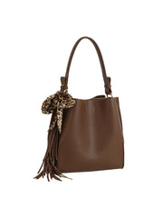 The HR Leopard Scarf Tassel Tote is a brown faux leather bag with a top handle, leopard print bow, and fringe tassels. It offers a spacious interior for organizing essentials. Pictured against a white background.