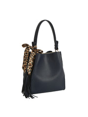 The HR Leopard Scarf Tassel Tote is a black faux leather bag with a single handle, detailed with a leopard print scarf and black fringe tassels, displayed against a white background.
