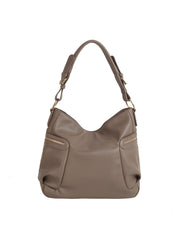The HR Soft Slouch Zip Shoulder Bag is a taupe faux leather handbag with gold hardware, a short handle, two front zip pockets, an adjustable strap for versatile styling, and a minimal, elegant slouch design.